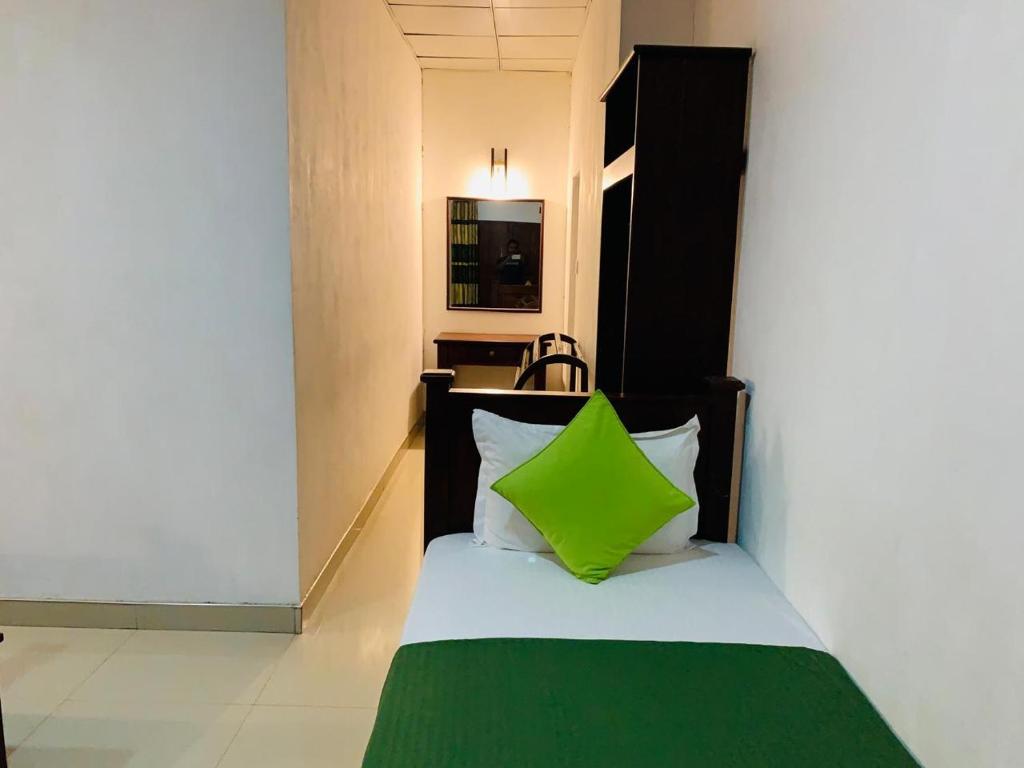 Postel nebo postele na pokoji v ubytování Habarana Dulwan Guest House