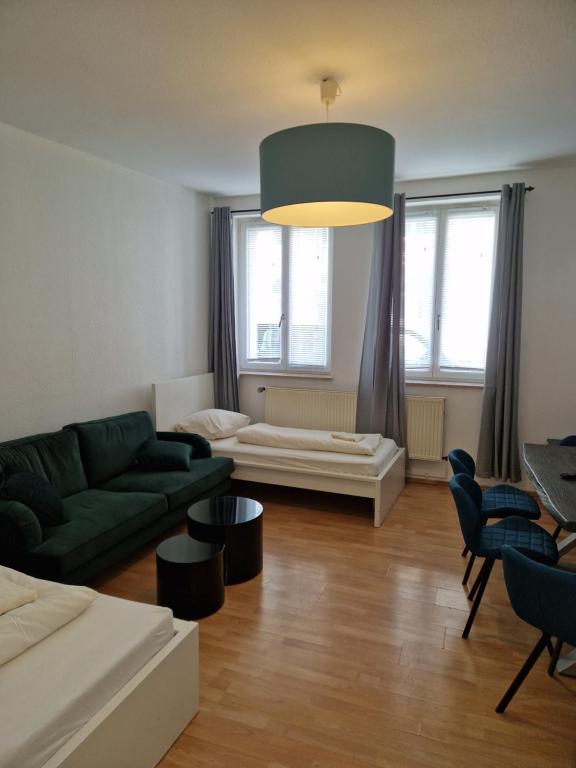 a living room with a couch and a table at City Apart Hannover in Hannover