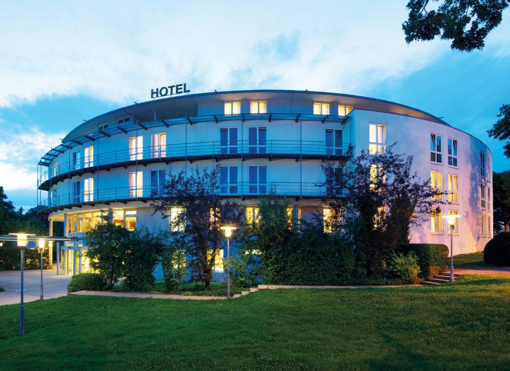 a round building with a sign on top of it at Hotel Kapuzinerhof in Biberach an der Riß