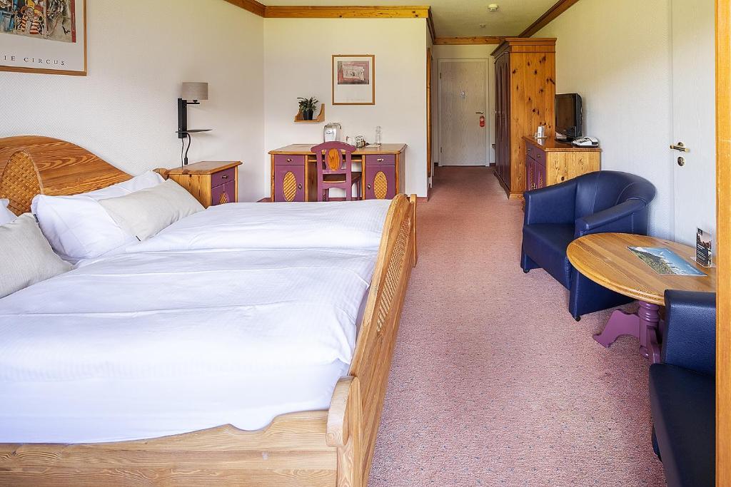 Postel nebo postele na pokoji v ubytování Hotel Bodmi
