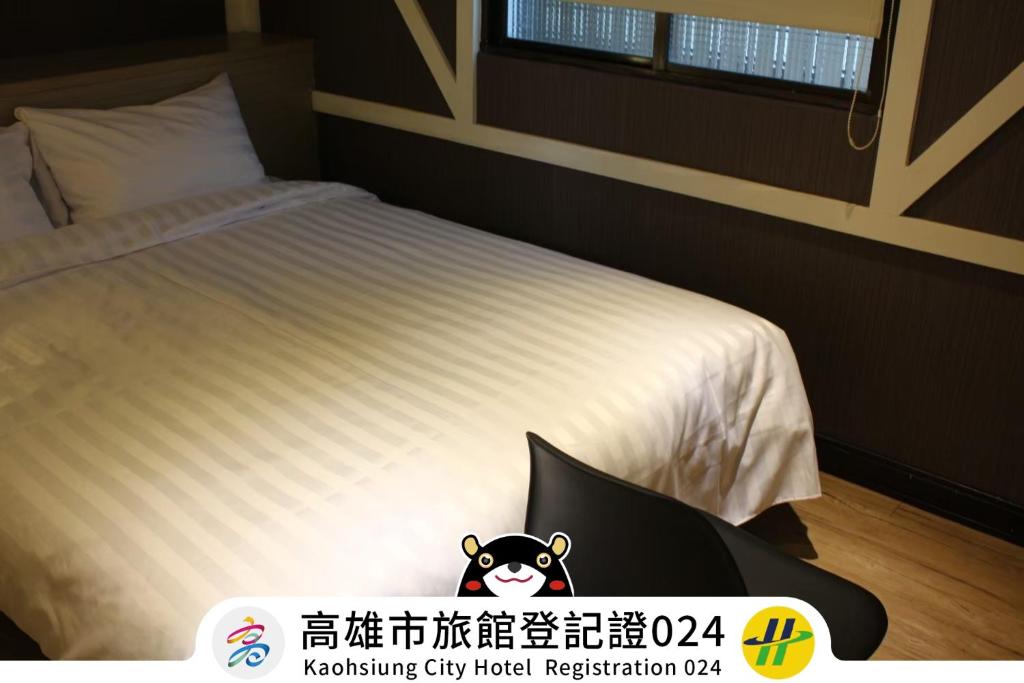 Postel nebo postele na pokoji v ubytování Win Inn Kaohsiung Hotel