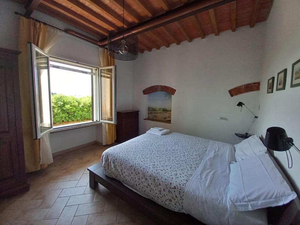 Ένα ή περισσότερα κρεβάτια σε δωμάτιο στο Bilocale Agriturismo Le Pinete a Riotorto