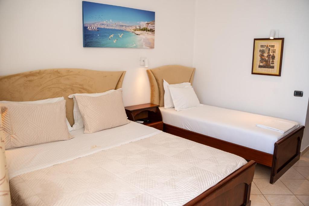 Postel nebo postele na pokoji v ubytování Hotel VISAD