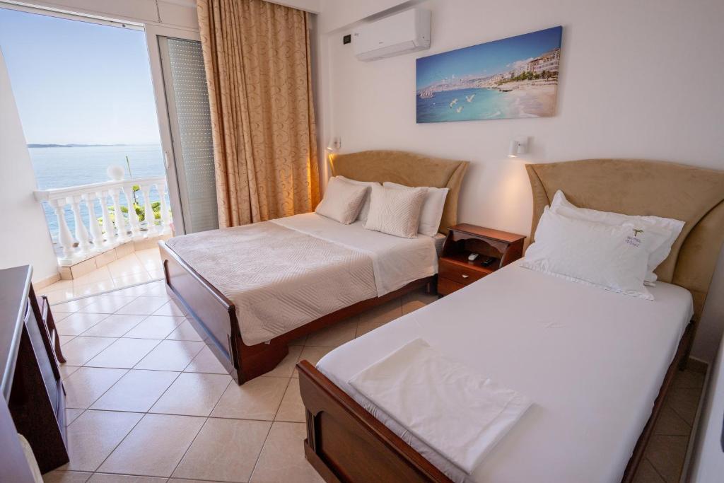 Postel nebo postele na pokoji v ubytování Hotel VISAD