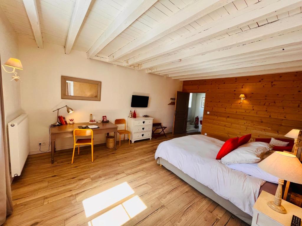 Postel nebo postele na pokoji v ubytování La Colonie - Maison d'Hôtes