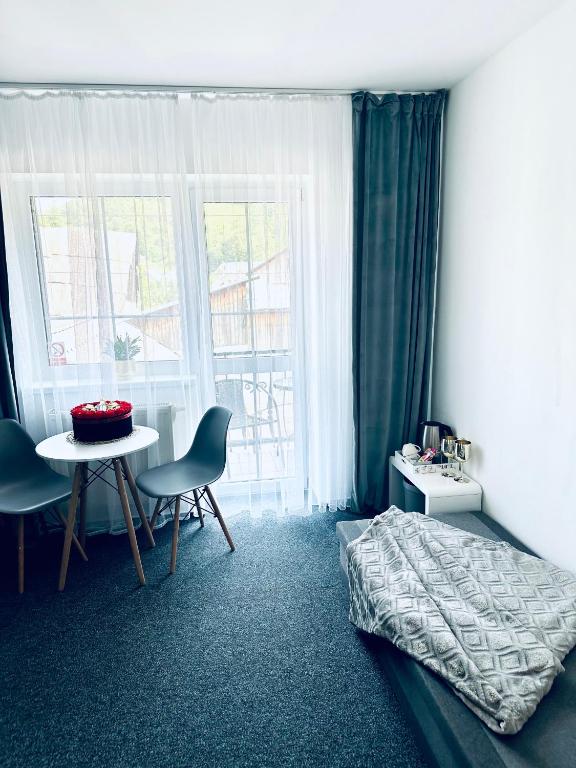 Postel nebo postele na pokoji v ubytování Penzión BACH