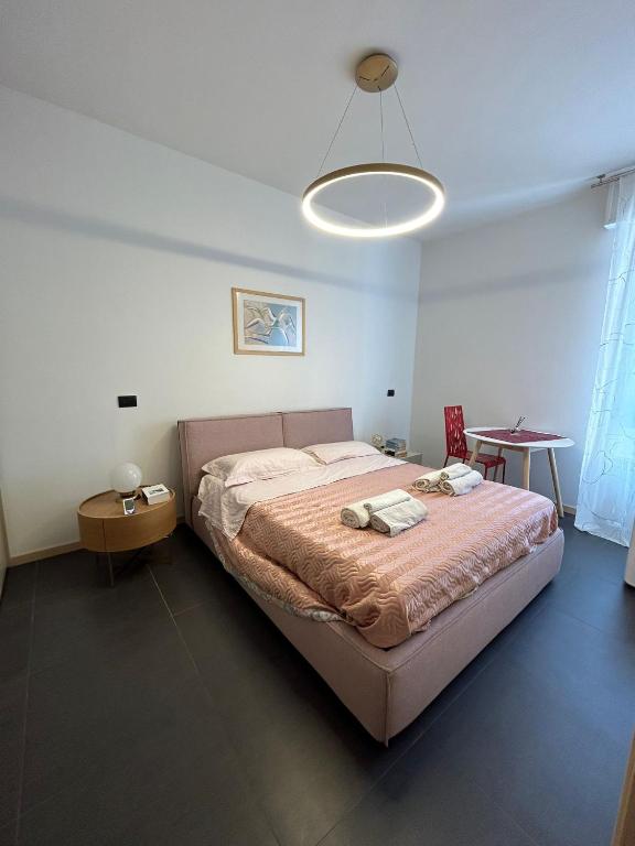 a bedroom with a large bed in a room at M&M BERGAMO CENTER - Modern flat with FREE WIFI - Rent BIKE in Bergamo