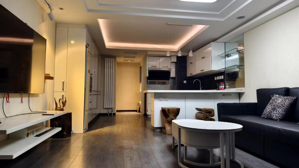 Kuchyň nebo kuchyňský kout v ubytování Chaoyang Joy City Hardcover Apartment