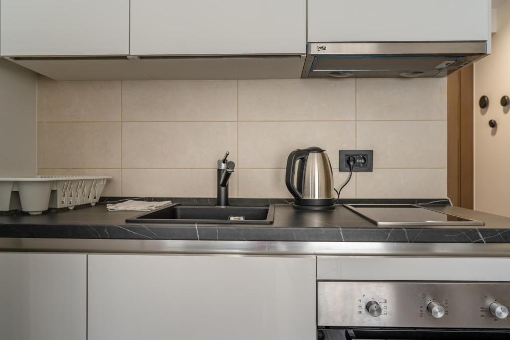 Eldhús eða eldhúskrókur á Kondina Suites