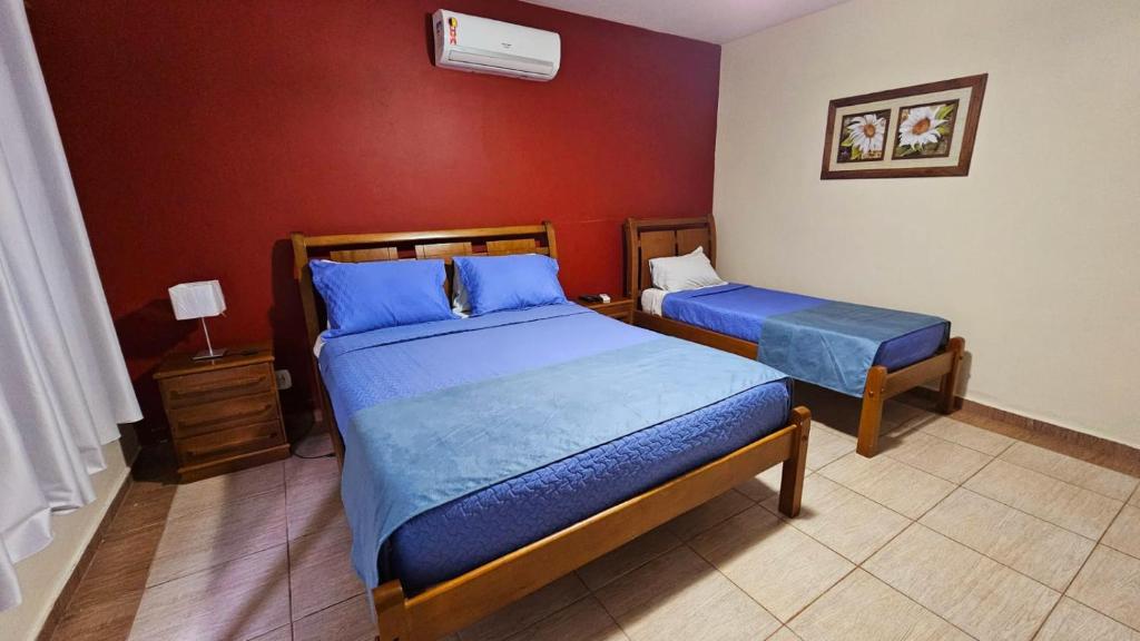 Uma cama ou camas num quarto em Hotel Pousada Bambuzal