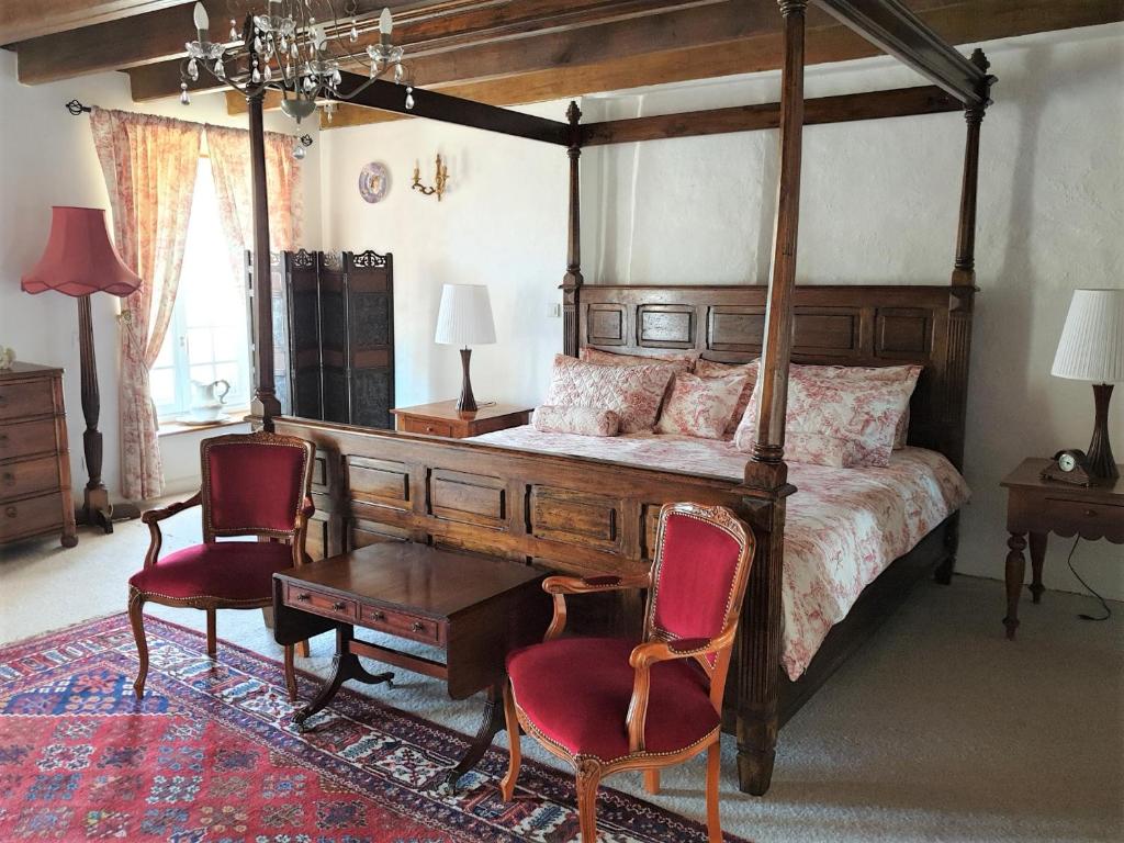 Postel nebo postele na pokoji v ubytování Maison St. James