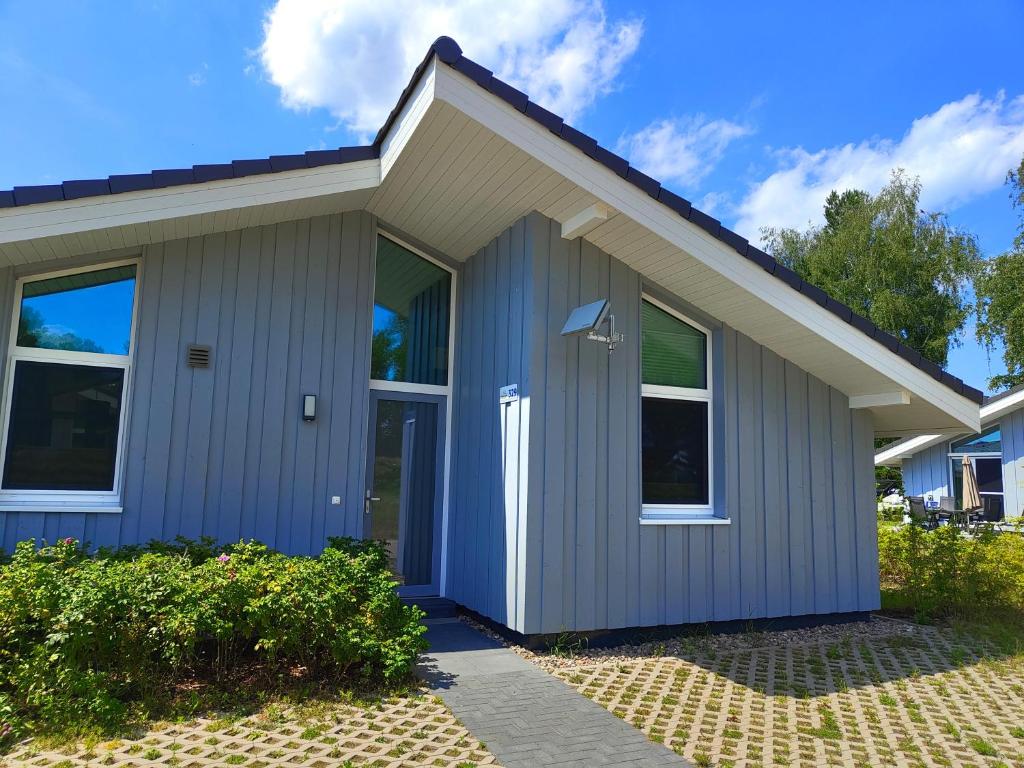 a home with a gray house at Seeschwalbe 329 in Mirow