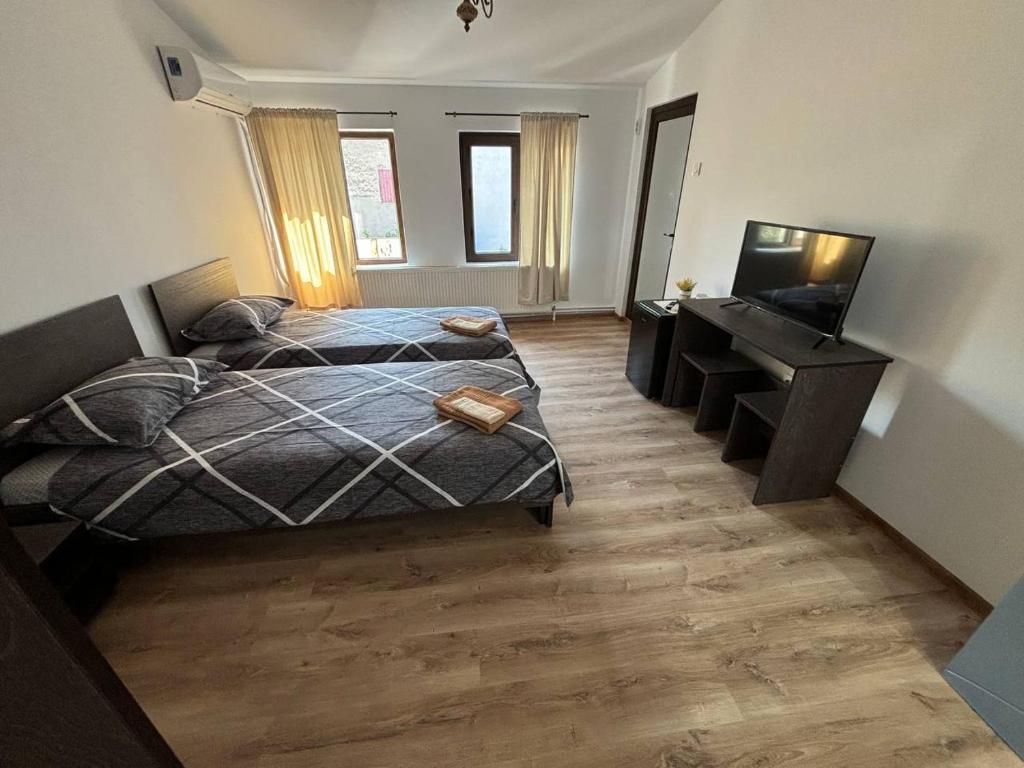 Postel nebo postele na pokoji v ubytování Alexander Residence