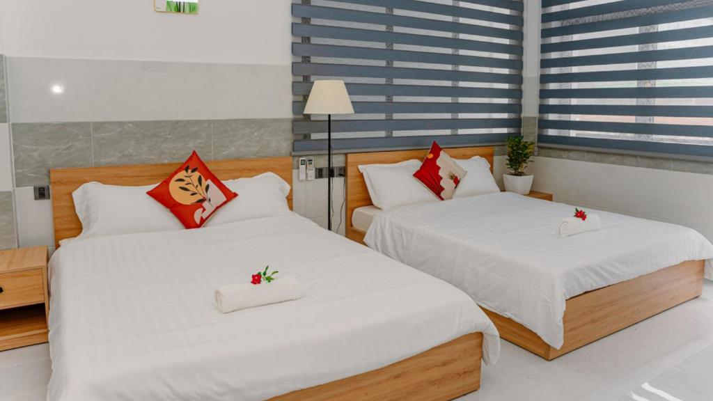 Postel nebo postele na pokoji v ubytování ALOHA SAIGON PREMIUM HOSTEL by Local Travel Experts - Newly opened, Less-touristy location, Spacious rooms, Glass shower bathroom, Free breakfast & Walking Tour