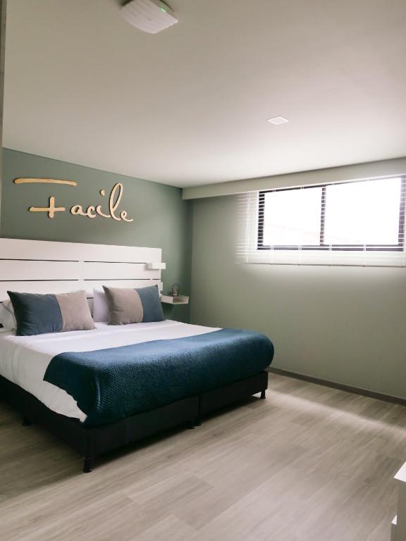 Postel nebo postele na pokoji v ubytování Facile habitaciones