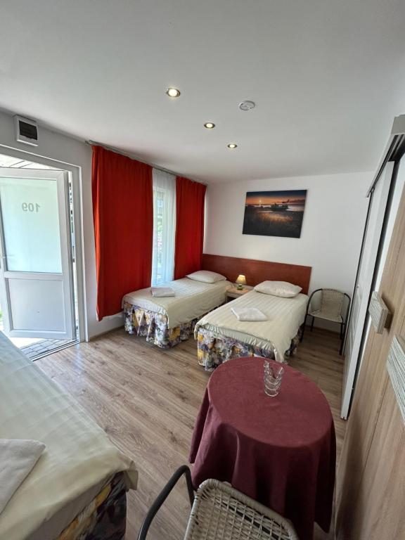 Postel nebo postele na pokoji v ubytování Stilo Hotel
