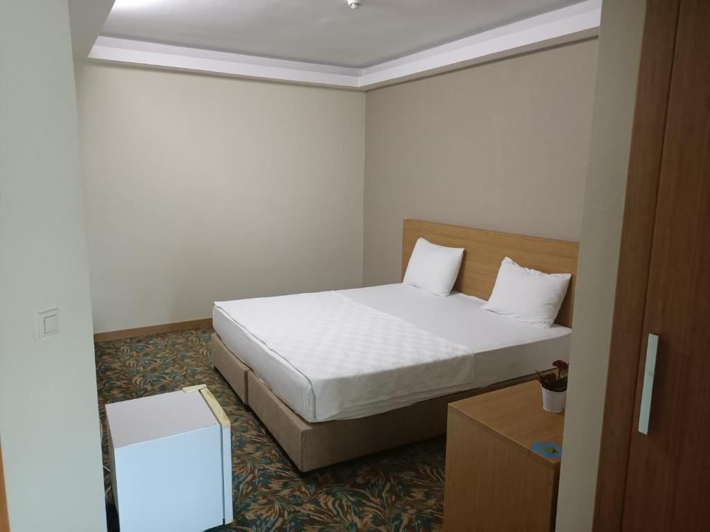 Postel nebo postele na pokoji v ubytování Helenapolis Otel