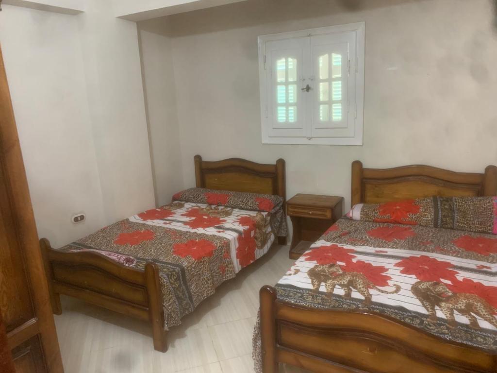 Postel nebo postele na pokoji v ubytování Burj al Huda