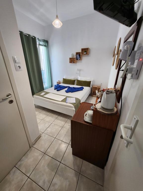 Postel nebo postele na pokoji v ubytování Kato Yialos Paros