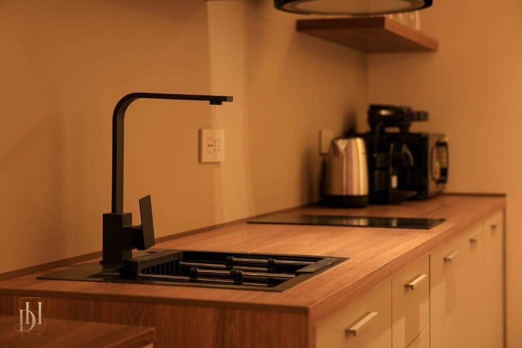 Kuchyň nebo kuchyňský kout v ubytování DeHa Rooms & Apartments