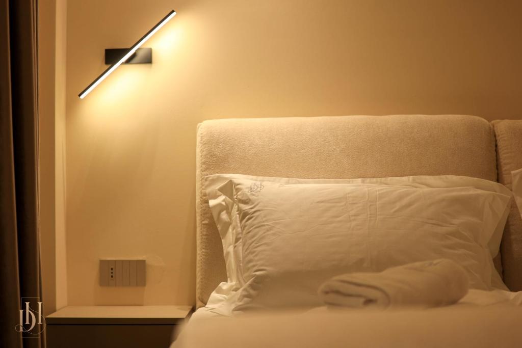 Postel nebo postele na pokoji v ubytování DeHa Rooms & Apartments