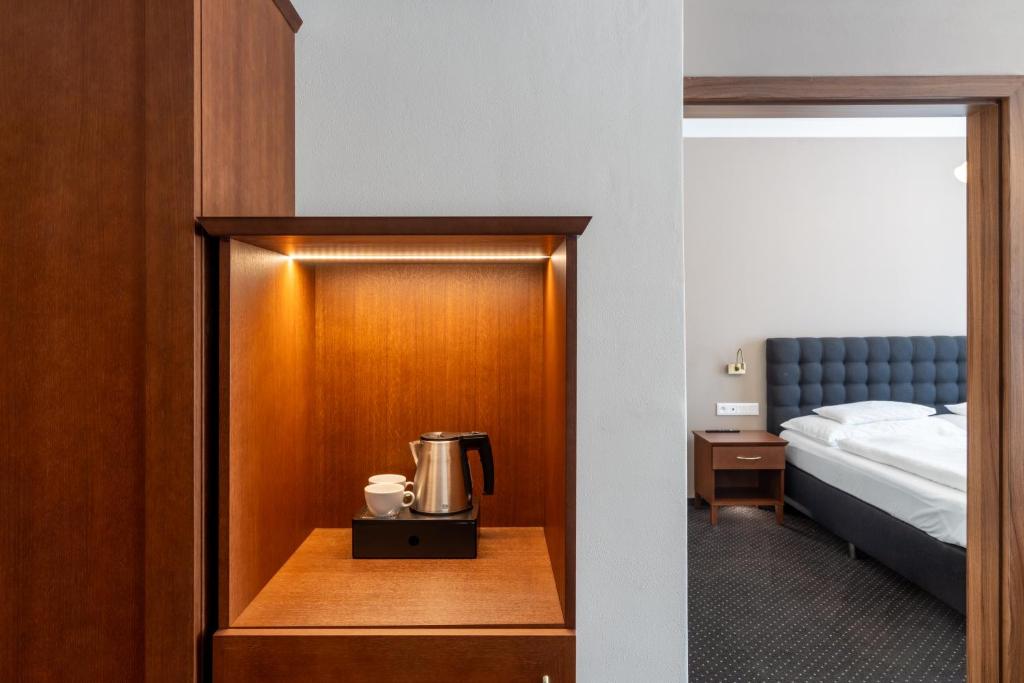 Posteľ alebo postele v izbe v ubytovaní Hotel Polana