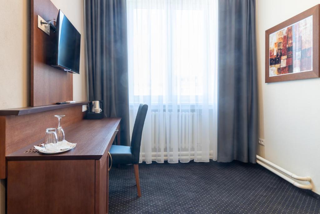 Televízia a/alebo spoločenská miestnosť v ubytovaní Hotel Polana