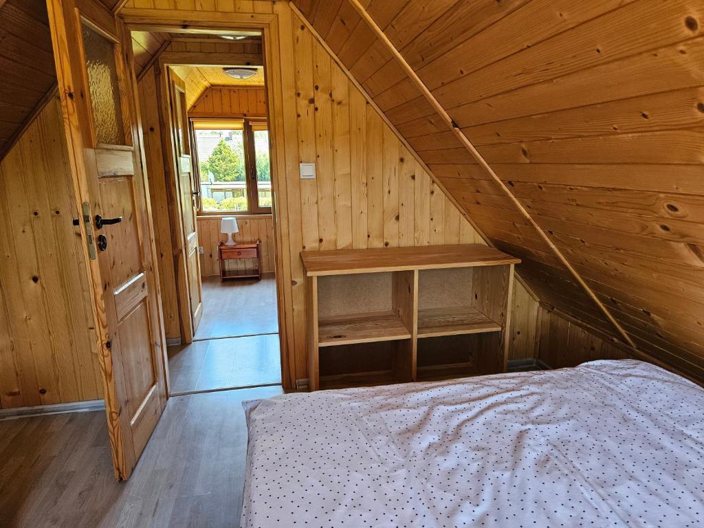 Postel nebo postele na pokoji v ubytování Domki pod gruszą