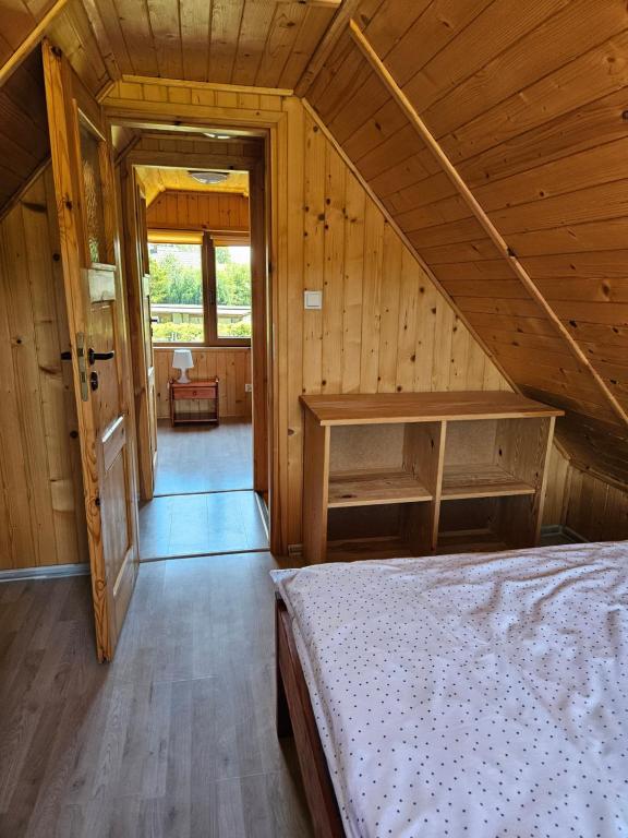 Postel nebo postele na pokoji v ubytování Domki pod gruszą