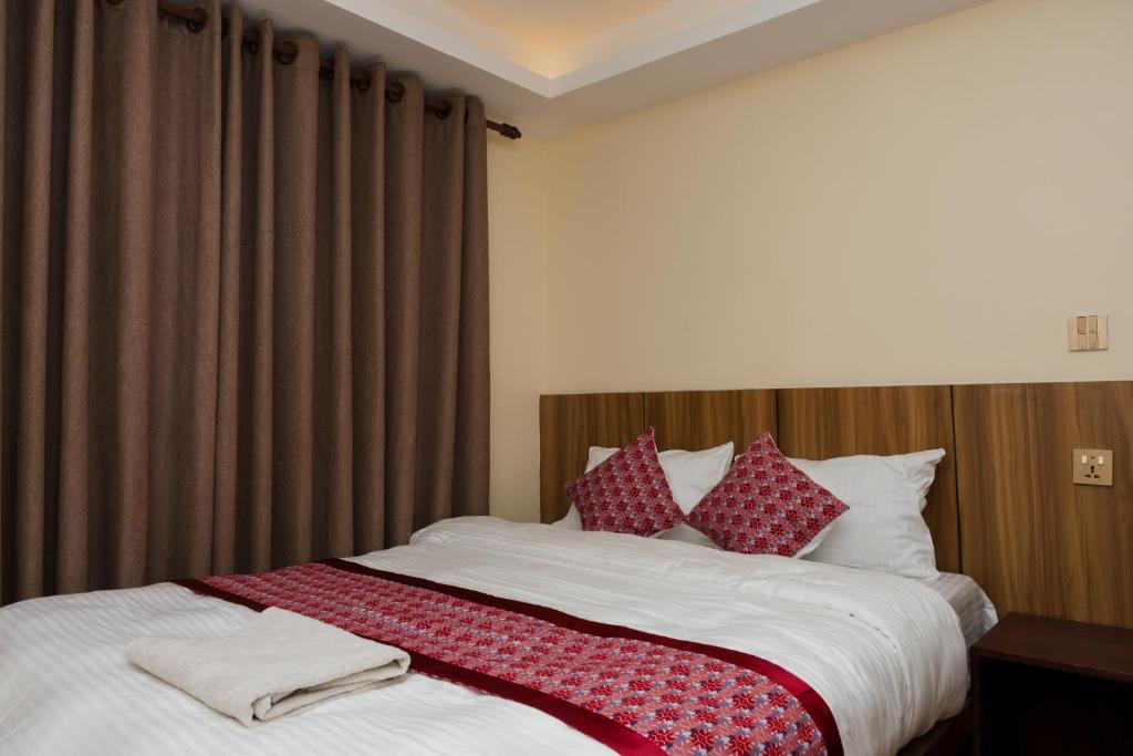 Postel nebo postele na pokoji v ubytování Rightway Hotel & Restaurant