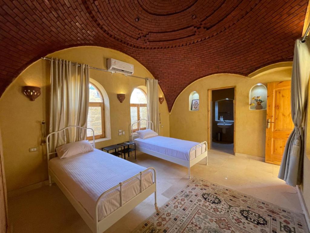 Postel nebo postele na pokoji v ubytování Hoopoe lodge