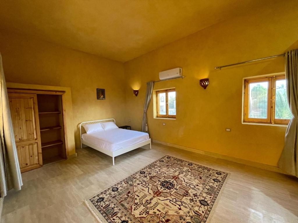 Postel nebo postele na pokoji v ubytování Hoopoe lodge