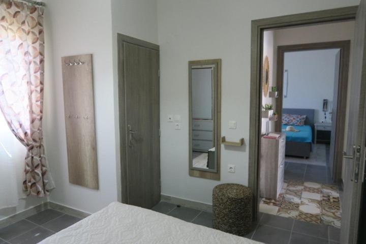 Postel nebo postele na pokoji v ubytování Drosoula House