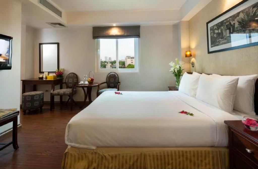 Postel nebo postele na pokoji v ubytování Skylark Boutique Hotel