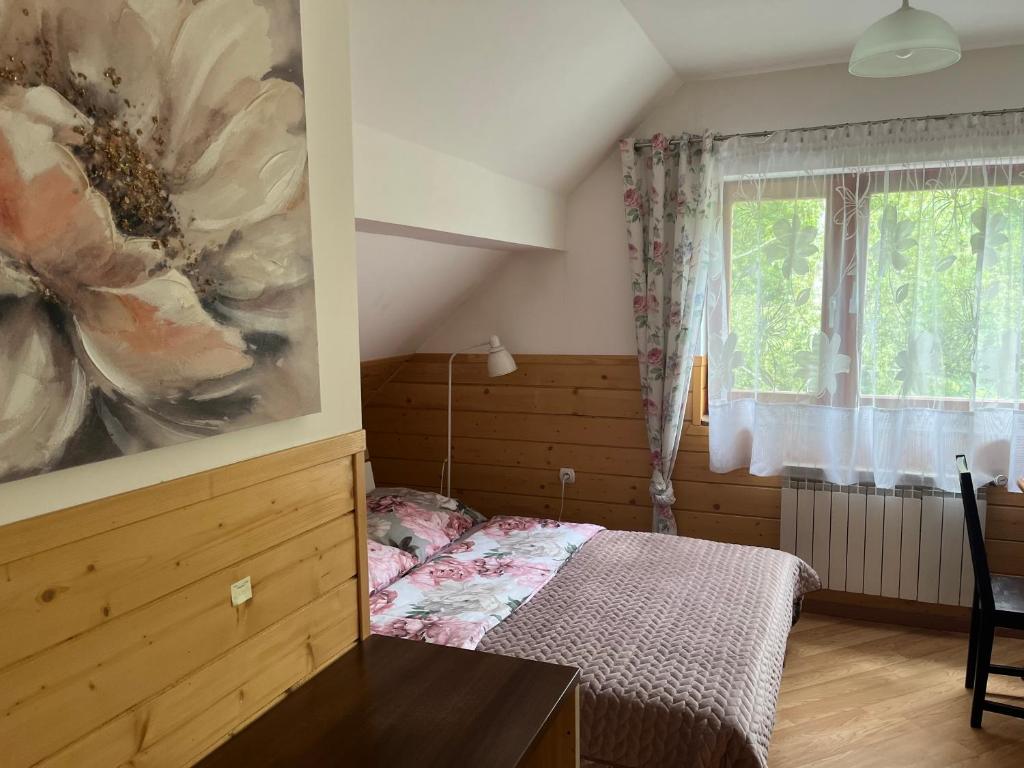 Postel nebo postele na pokoji v ubytování Domek Kozia Grapka
