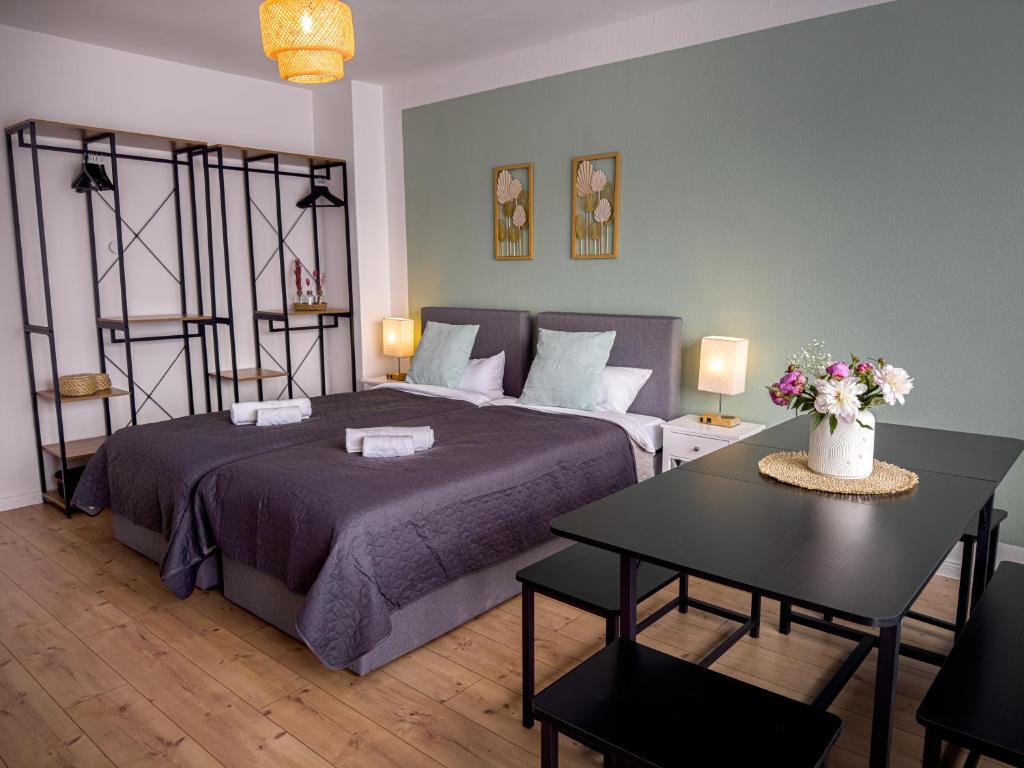 En eller flere senge i et værelse på ImmoStay D# City Apartment - Modern & WiFi