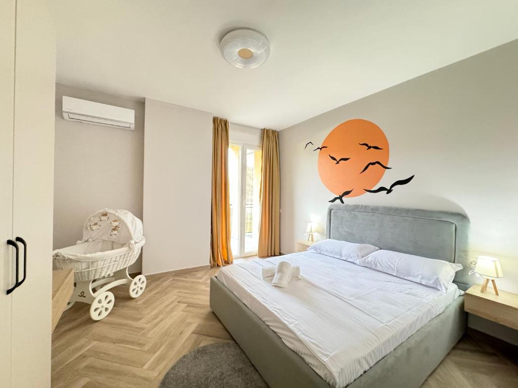Postel nebo postele na pokoji v ubytování R Apartments