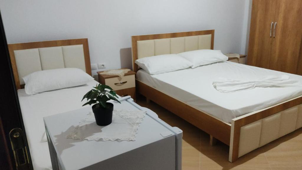 Postel nebo postele na pokoji v ubytování Dino Guest House