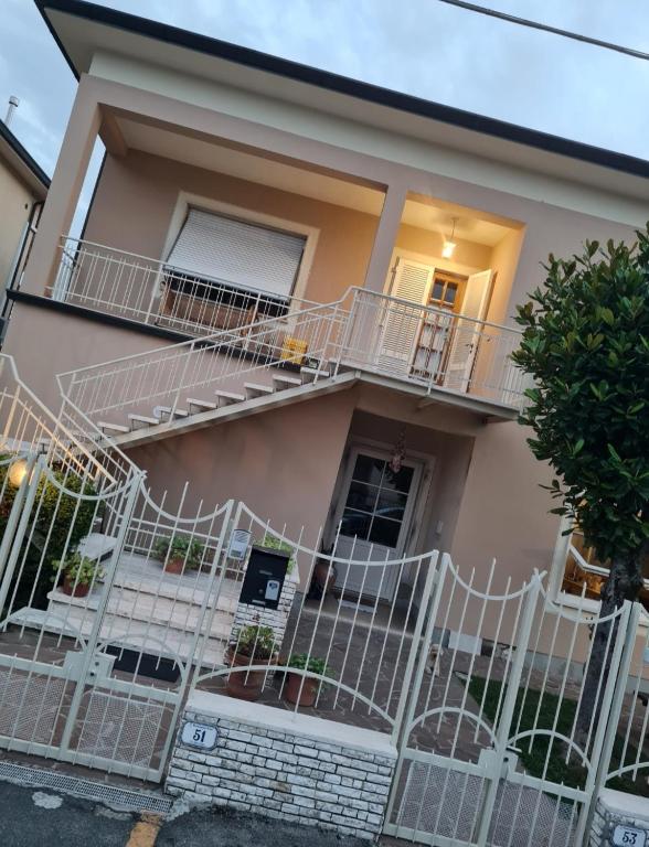a house with white stairs in front of it at Locanda di Sandro in Monsummano Terme
