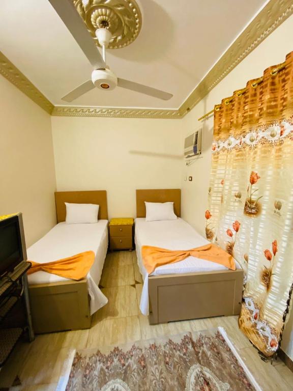 Postel nebo postele na pokoji v ubytování Basmatic2 Nubian Guest House