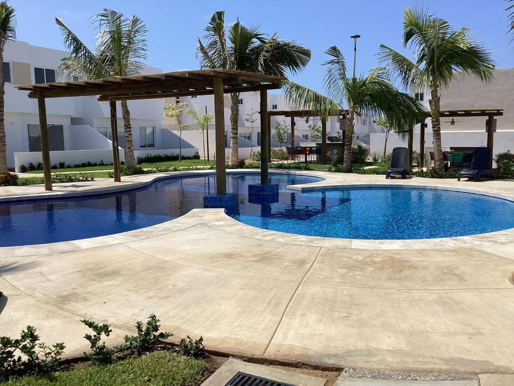 Πισίνα στο ή κοντά στο Almarena Frente al Área Común 4min playa