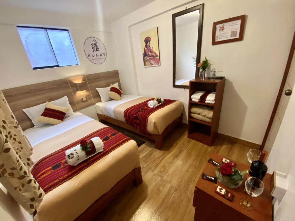 Postel nebo postele na pokoji v ubytování Runas Inn Machupicchu