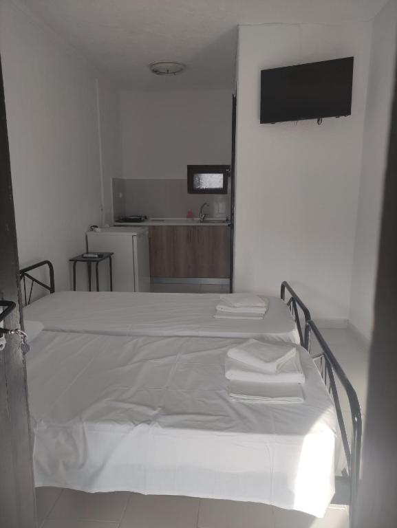 Postel nebo postele na pokoji v ubytování Sirocco Seaside