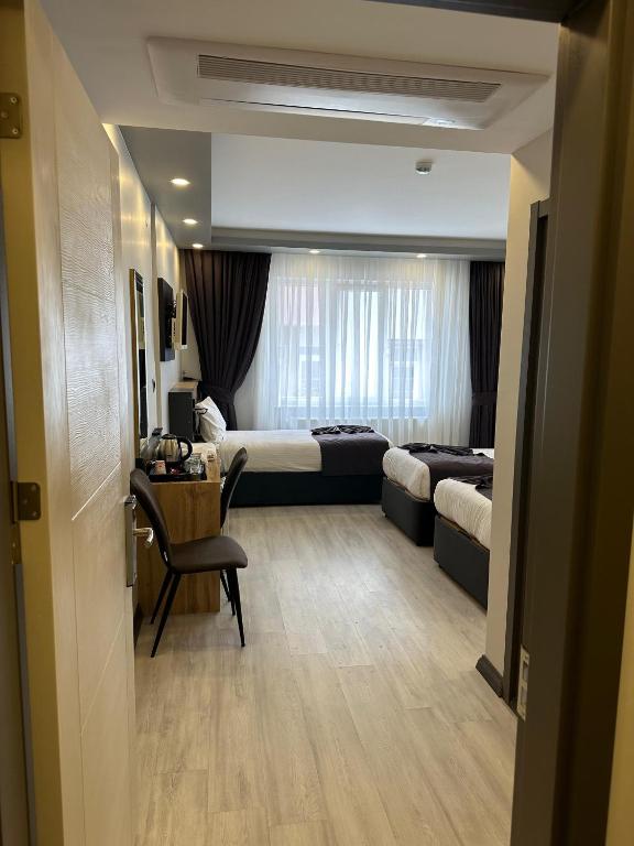 Postel nebo postele na pokoji v ubytování Ofpark Otel
