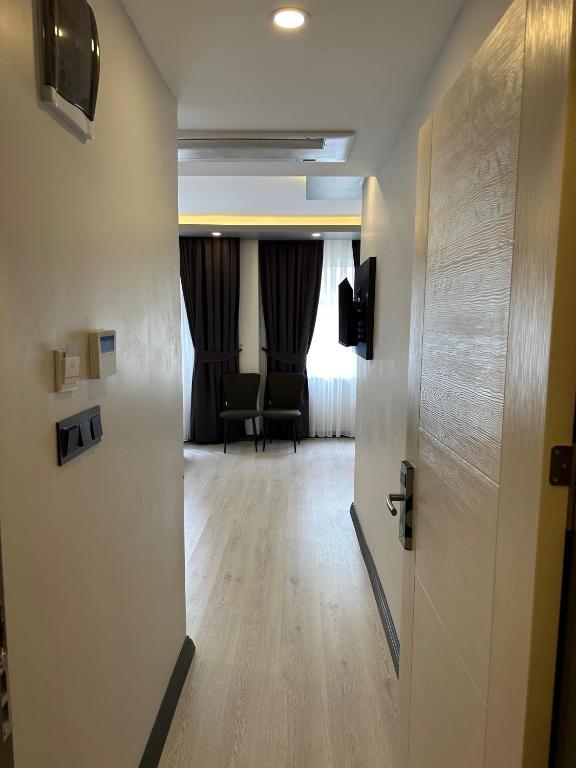 Postel nebo postele na pokoji v ubytování Ofpark Otel