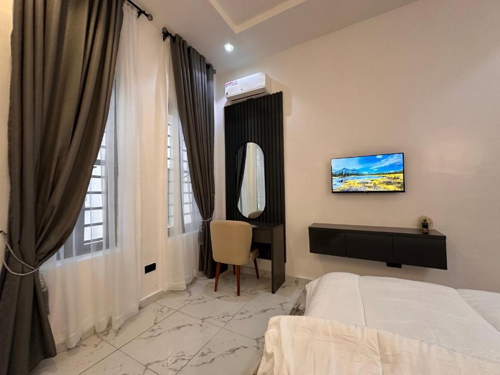 Postel nebo postele na pokoji v ubytování Tranquil Haven Lekki