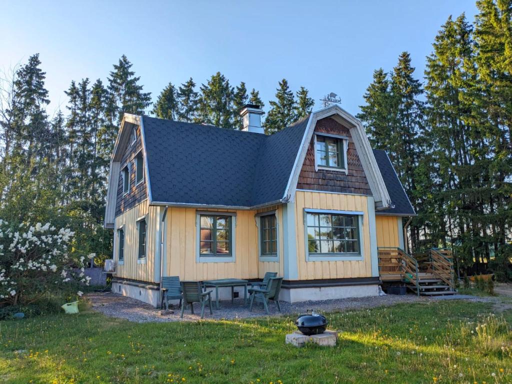 a tiny house with a gambrel roof at Villa Freia in Nukari