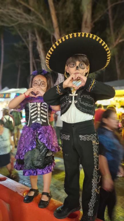 a couple of people dressed up in costumes at On The Beach Seaside Sunrise Haven 4 Sea View in Cancún