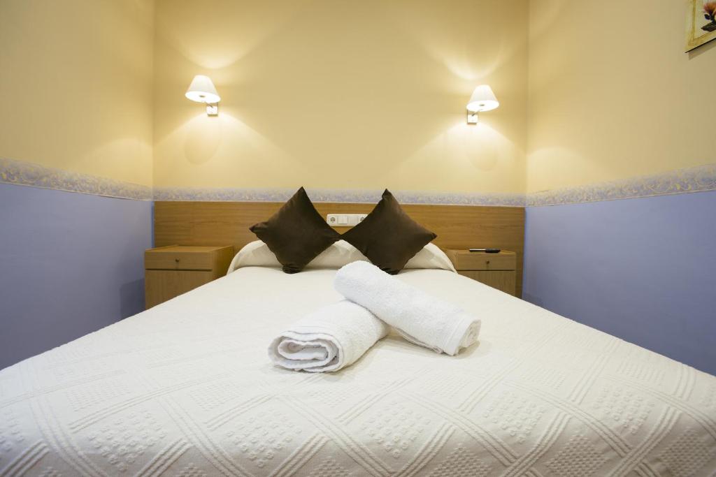 Cama o camas de una habitación en Pensión San Jerónimo