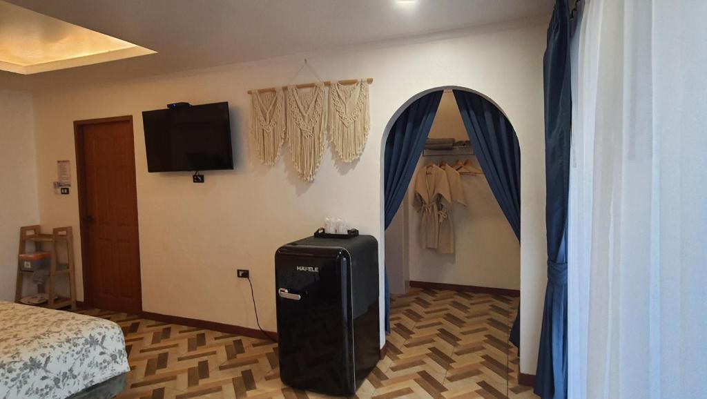 TV a/nebo společenská místnost v ubytování บ้านมัจฉา